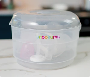 Snookums electric steam steriliser with baby feeding accessories inside
